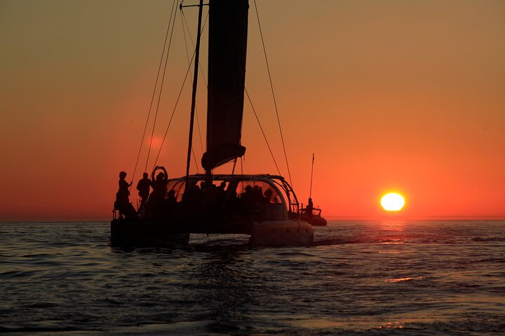 Experience the beauty of Cape Town at sunset aboard a spacious catamaran with stunning views of Table Mountain and the shimmering Atlantic waters. Perfect for gatherings or leisurely moments.